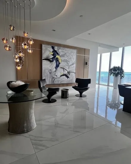 Luxury condo moving services completed in a modern living room with glossy floors and ocean views